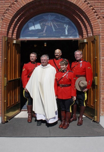 Members of St. Albert&#8217;s RCMP detachment attend last year&#8217;s Blue Sunday Mass at the St. Albert Parish. The service offers special prayers to emergency responders