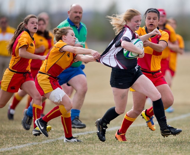 BREAKING AWAY – McKenzie Pusch draws a crowd as the Strathcona Lords try to slow down the Bellerose Bulldog in Tuesday&#8217;s metro Edmonton division one match at the St.