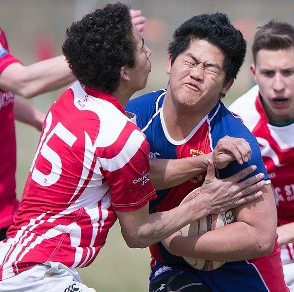 KA-BOOM – Nathan Yue of the St. Albert Rugby Football Club runs into contact in Saturday&#8217;s 34-7 third division victory against the Strathcona Druids at Lynn Davies