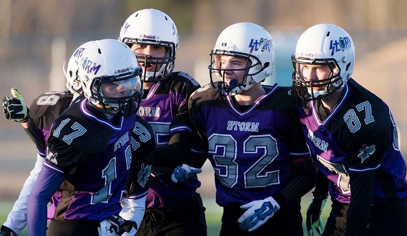 STORM WATCH – The St. Albert Storm celebrate an interception during a midget spring league division one game in the Capital District Minor Football Association. The Storm