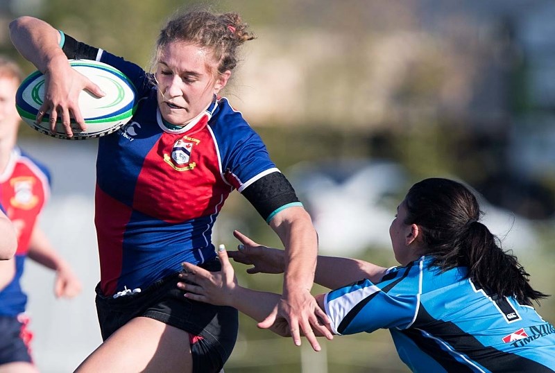 DEEKING AROUND &#8211; Sabrina Kelly gets ahead of an opponent at their game against the Parkland Sharks on Wednesday at the St. Albert Rugby Football Club. St. Albert won