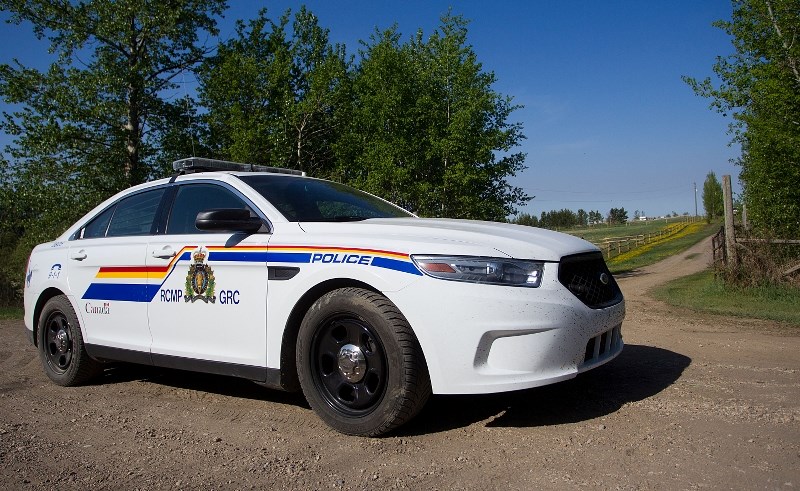 OFFICER-INVOLVED SHOOTING – A police car blocks the driveway to a rural property on Range Road 263 on Saturday morning. A gun-wielding man was shot and killed by police in a