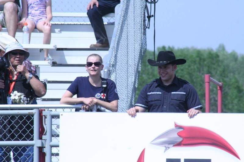 CLOSE TO THE ACTION – Rodeo medics Jessica Maisonneuve and Zak Souter-Lucas say minor injuries keep them busy during the rodeo.