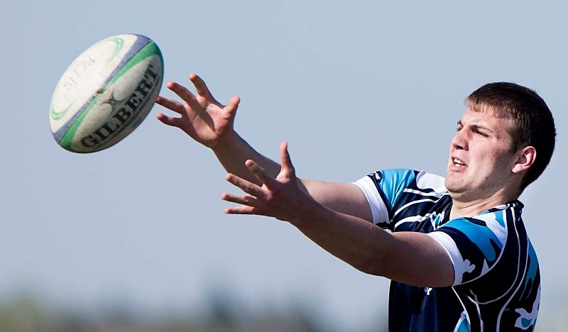AIR BALL – Ben Kluyts of the Paul Kane Blues reaches for a lineout ball during metro Edmonton high school rugby action. Today at 4:45 p.m. the Blues (4-1) play the Bev Facey