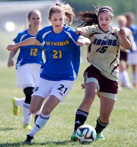 BALL HAWK – Marissa Webb of the St. Albert Skyhawks attacks the ball with MacKenzie Sharun in the background in Thursday&#8217;s metro Edmonton division two playoff against