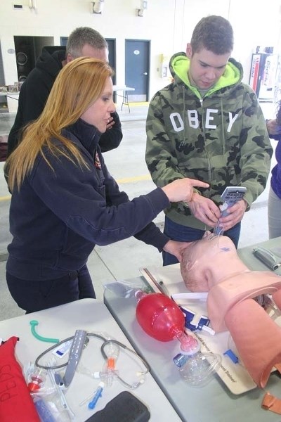 LIFE-SAVING DEMOS – Paramedic Christa Warwa works with Jayden Van Leeuwen as he intubates a CPR dummy.