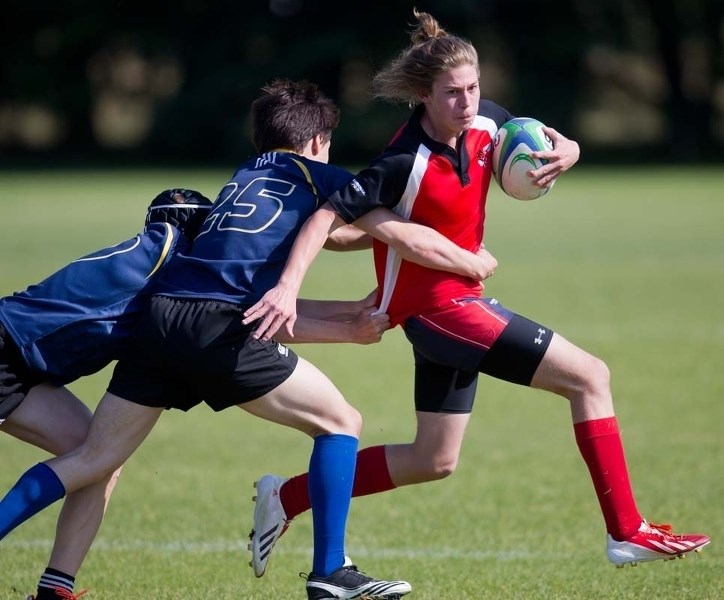 PRESSURED – Liam Speers of the Sturgeon Spirits is tracked down by the Bev Facey Falcons in Monday&#8217;s metro Edmonton division two final at Ellerslie Rugby Park. Sturgeon 