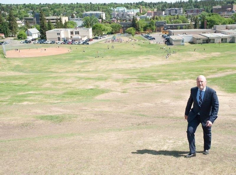 EMPTY&#8230; FOR NOW – Greater St. Albert Catholic school superintendent David Keohane ascends Mission Hill Wednesday. The hill behind him will be packed with some 6