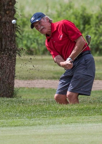 BUNKER SHOT – Sturgeon Valley Golf &amp; Country Club member Doug de Bruijn blasts the ball out of a bunker during Thursday&#8217;s round of golf. Sturgeon Valley is hosting