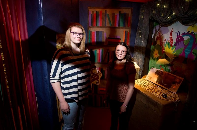 The library&#8217;s summer reading assistants show off the castle at the heart of the Dragon Riders&#8217; Academy
