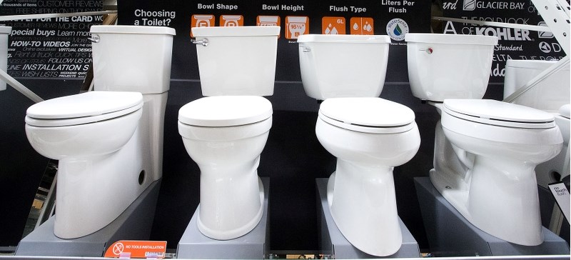 TOILET CASH – A variety of high efficiency toilets seen on display at The Home Depot on Monday. City residents who buy a WaterSense-certified low or dual-flush toilet this