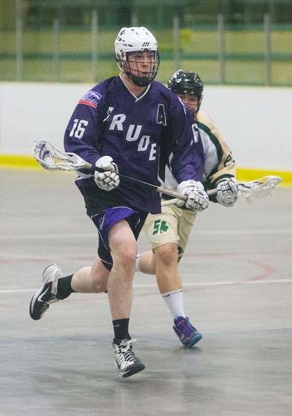 ??? – Cam Ellingson of the St. Albert Crude breaks away from his Calgary Shamrocks opponent during lacrosse action at Akinsdale Arena on Sunday afternoon.