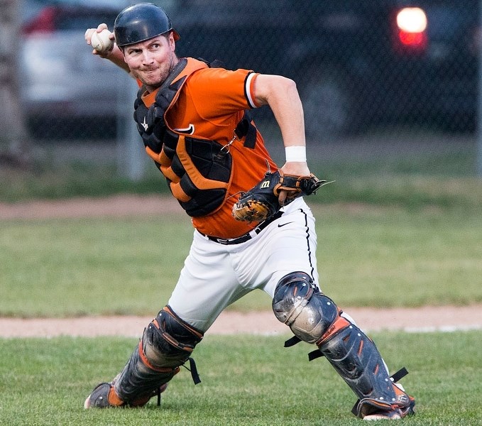 THROW TO FIRST – St. Albert Tigers catcher Brad Wolansky aims for a throw to first during their game against the Parkland White Sox on Friday at Legion Memorial Park