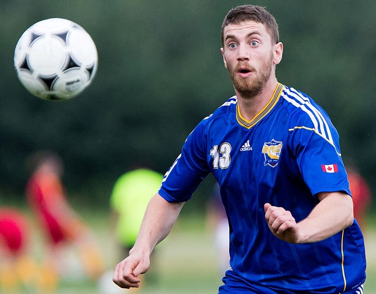 EYE LEVEL – Aaron Lasouch of the St. Albert Impact eyes up the ball during their game against AC Milan on Wednesday at the ESA Complex. The Impact fell to Milan 1-0.