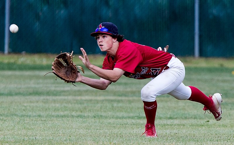 MAKING THE CATCH – Conor Bronston of the Midget AAA Cardinals lines up for a fielded ball