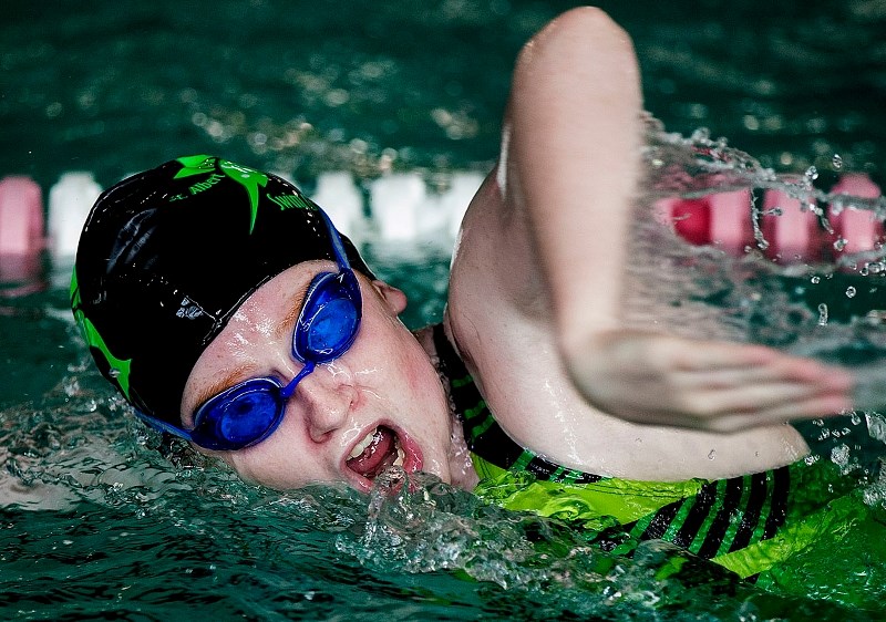 MID STROKE – Paige Skogstad of the St. Albert Sailfish Swim Club gasps for air during a practice lap at the Fountain Park Pool on Thursday.