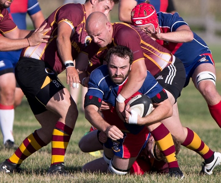 TACKLED – Brett Kelly of the St. Albert premier men&#8217;s rugby team gets wrapped up in Thursday&#8217;s 43-15 victory over the Nor&#8217;Westers in the Alberta Cup