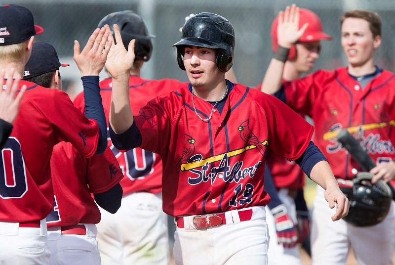 HIGH FIVES – Jake Fischer and the St. Albert Cardinals celebrate success during a NorWest midget AAA league game at Legion Memorial Park. This weekend the 2014 Baseball