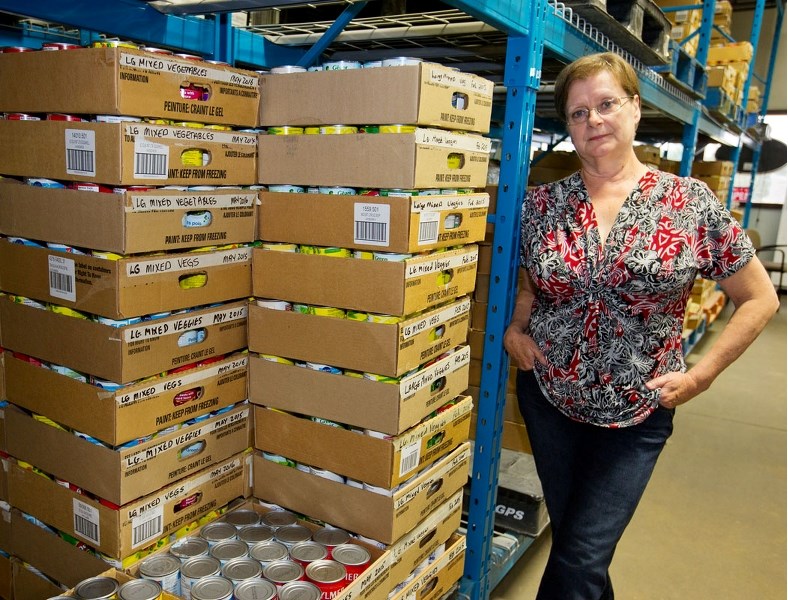 St. Albert Food Bank executive director Suzan Krecsy surveys the new donations