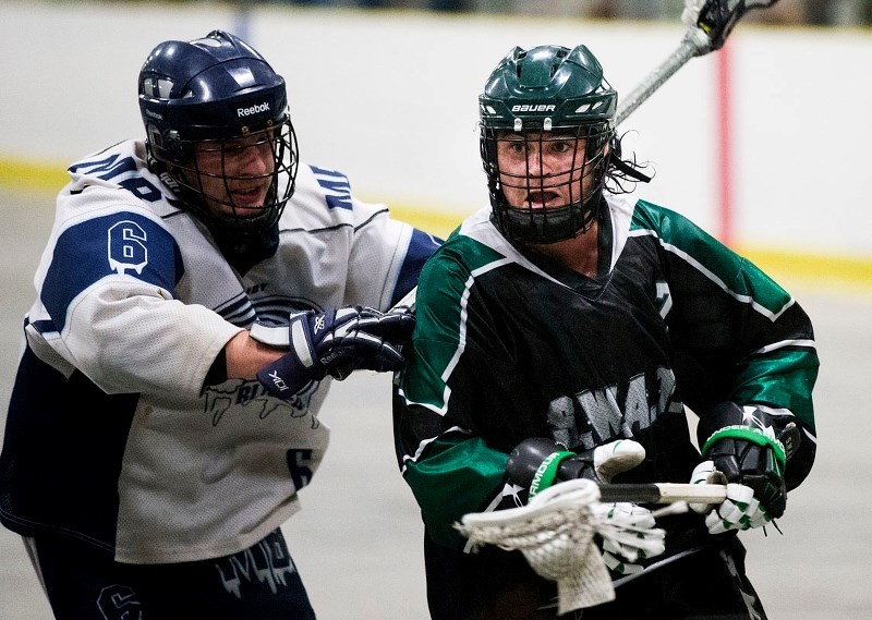 PROVINCIAL SHOWDOWN – Sam Murphy of the Saskatchewn SWAT is checked by Anthony Melito of the Manitoba Blizzard in the Rocky Mountain Lacrosse League provincial junior B Tier