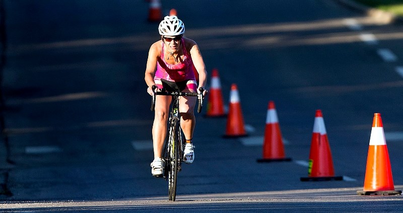 HILL CLIMBER – A rider makes her way up Sir Winston Churchill Avenue during the 26th annual St. Albert Triathlon on Sunday morning. The event featured 192 finishers in the