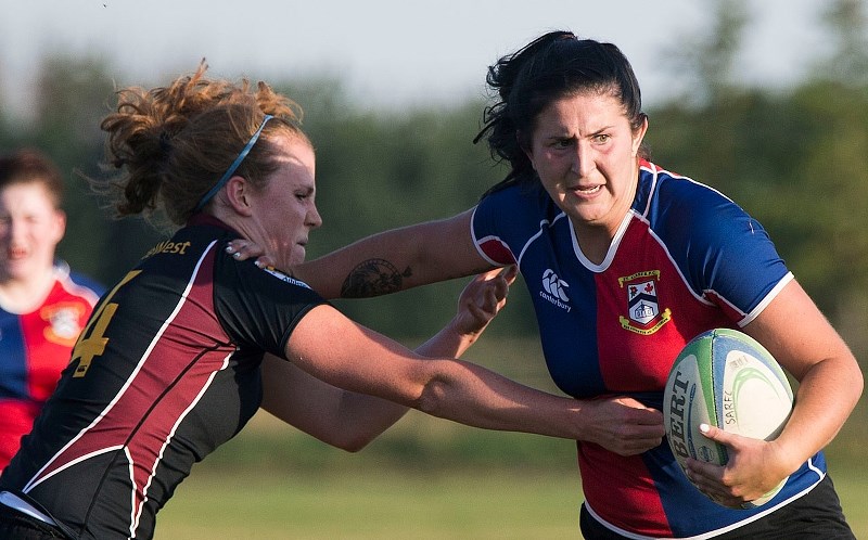 UNSTOPPABLE – Maddy Doyle of St. Albert powers through the Crude/West tacklers in Wednesday&#8217;s Alberta first division women&#8217;s contest at the Nor&#8217;Westers