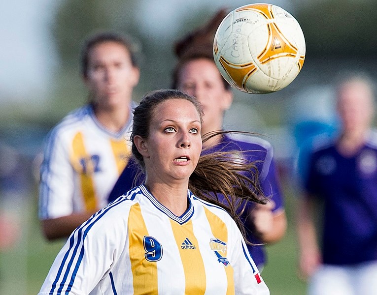 INCOMING – Melanie Seidel of the St. Albert Impact division 3A women&#8217;s team eyes up a header against Royals FC in the Edmonton District Soccer Association Tier 3
