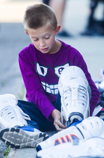 GEARING UP FOR HOCKEY – St. Albert atom player Austin Henry
