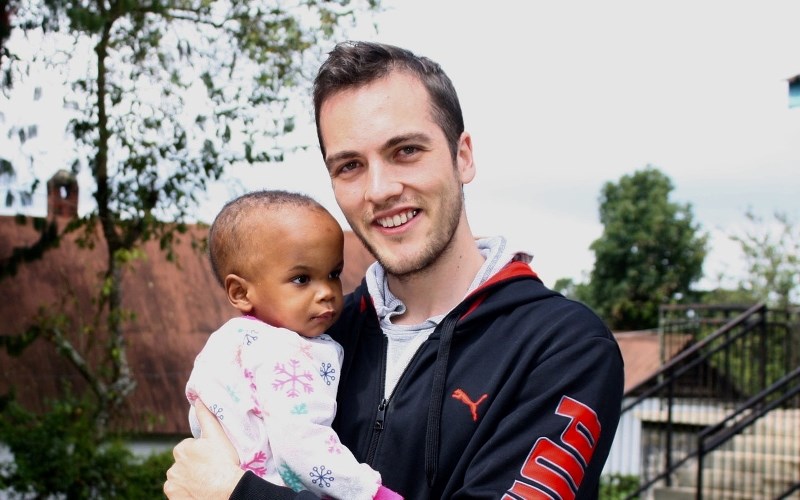 Cody Brooks with one of the &#8216;orphans&#8217; at Nkoaranga Orphanage in Tanzania. The facility works to reunite the children with their families