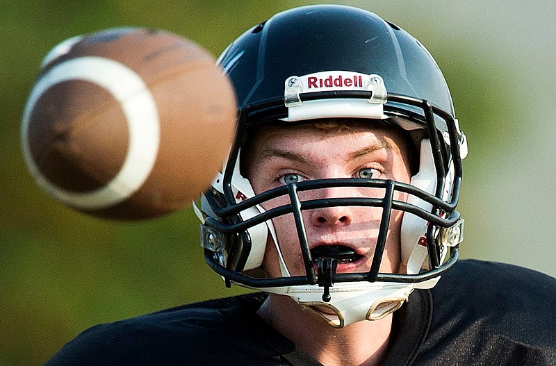 EYES ON THE BALL – Bryce Workman focuses on the football at the Bellerose Bulldogs&#8217; fall camp this week. The senior Bulldogs kick off the Carr division one season in