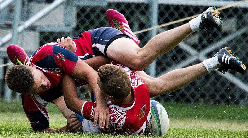 GRAPPLING &#8211; Drew Grant of St. Albert wrestles with a Strathcona Druid in the Edmonton Rugby Union U19 final Wednesday at Ellerslie Rugby Park. St. Albert suffered its