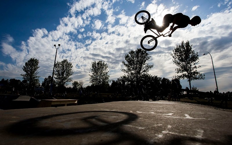 ROLLING OUT &#8211; BMX rider David Revoy finishes a backflip during the St. Albert Shake Down competiton on Sunday. The event featured local and out of town riders of all