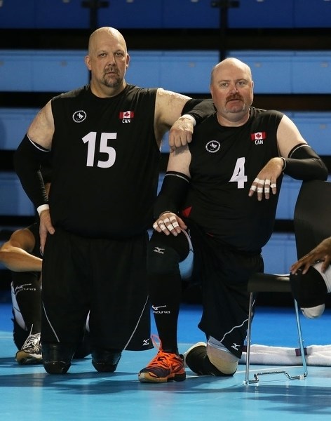PARAPAN AM MEDALLISTS – Dave Marchand (15) of St. Albert and Larry Matthews (4) of Villeneuve won bronze medals with Canada&#8217;s national sitting volleyball team at the