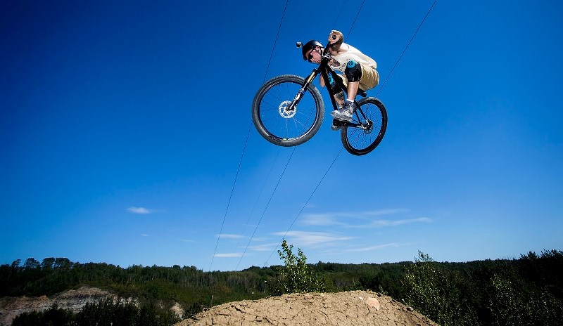 SKY HIGH &#8211; Trick rider X launches into the air at the Devon Bike Park