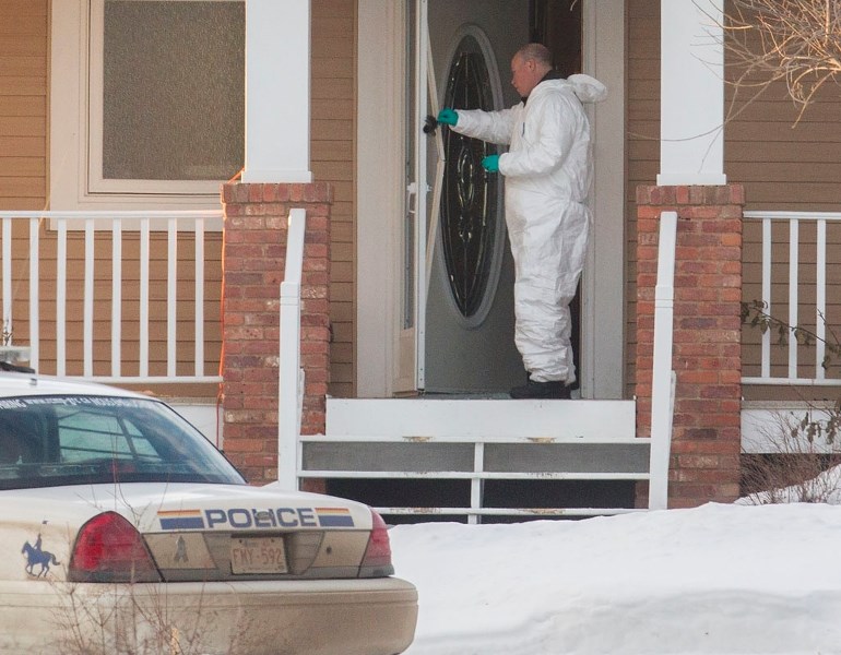 Foresnsic teams on scene at a residence in Sturgeon Heights where Shawn Rehn&#8217;s body was found.