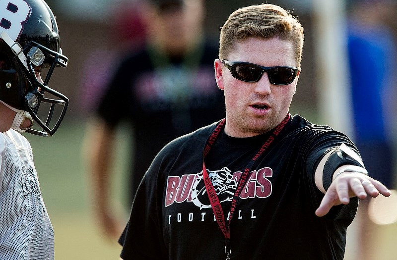 FIELD GENERAL – Head coach Chad Hill discusses a drill at a recent Bellerose Bulldogs&#8217; senior team practice. Friday the Bulldogs (1-1) play the Jasper Place Rebels