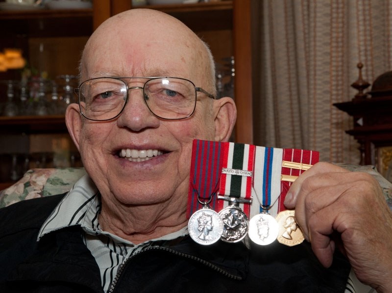 HERO – Retired air force pilot Bob Morgan of St. Albert shows off the many medals he received in his 36-year career. The one on the left is the George Medal