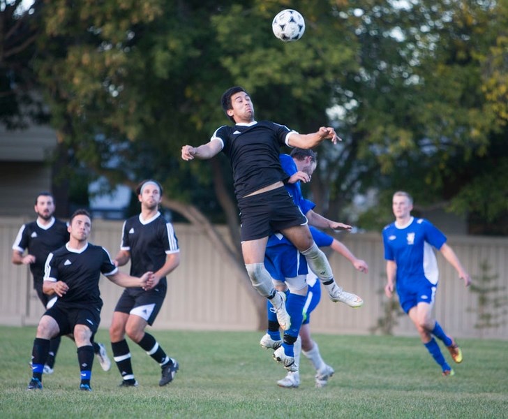 HIGH JUMPER – Roland Park of GSE goes airborne to head the ball against Chester City in the St. Albert Men&#8217;s Soccer League semifinals Thursday at Forest Park Field. GSE 