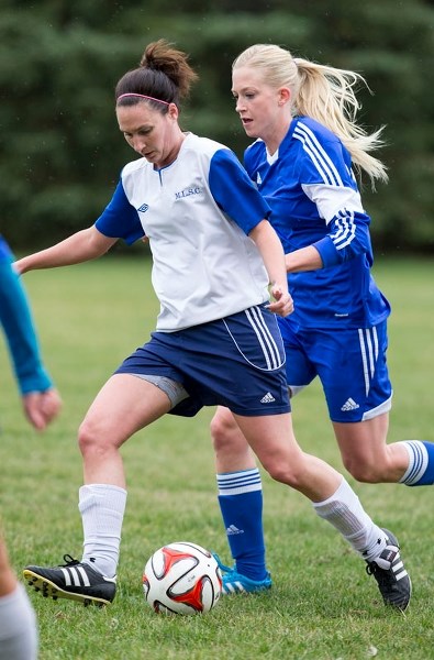 PLAYOFF SHOWDOWN &#8211; Sarah McKay of the Morinville Ladies plays the ball in front of Suzanne Schulz of Mavericks 09 in the St. Albert Women&#8217;s Soccer League division 