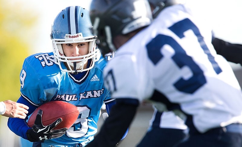 CARRYING THE MAIL – Moe Tarrabain of the Paul Kane Blues scored a touchdown on a five-yard run in the second quarter against the Ross Sheppard Thunderbirds in Tuesday&#8217;s 
