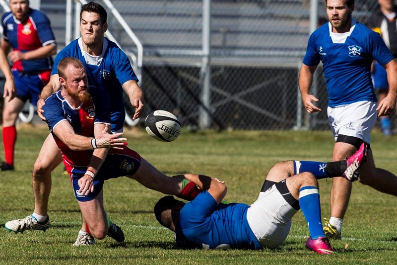 BALL RELEASE – Matt Herod of the St. Albert third division men&#8217;s team offloads the ball against the Pirates in the Visser Cup final in the Edmonton Rugby Union last