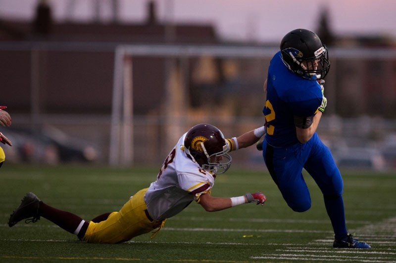PLAYOFF RUN – Brendan Gervais of the St. Albert High Skyhawks escapes a tackle during Miles division two action in the metro Edmonton football league. The Skyhawks (5-3)
