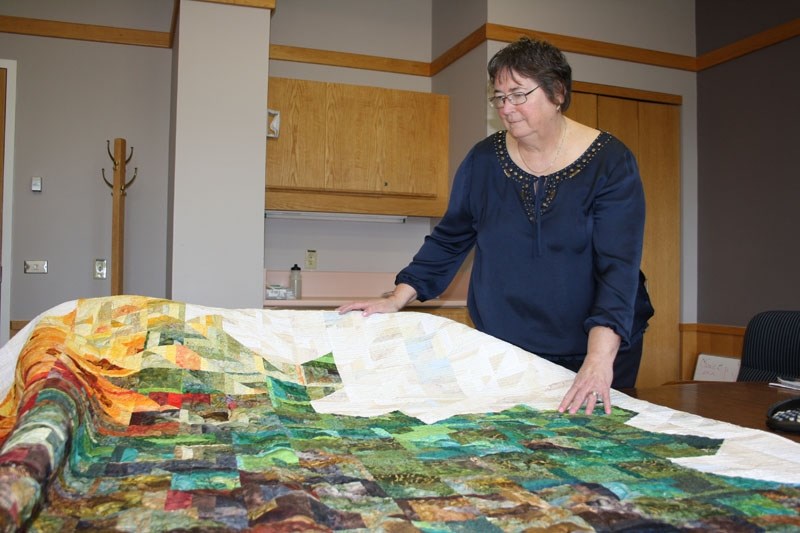 Lezley Zwaal with a handmade quilt in 2013.
