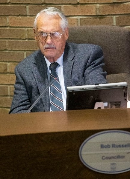 Coun. Bob Russell listens to budget proceedings on Thursday. He told library expansion supporters he would deduct $100 of his support per letter he receives lobbying for an