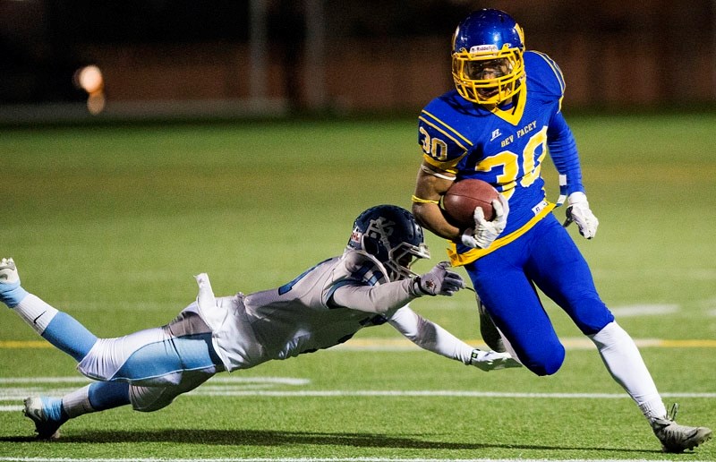 GAME STAR – Chuba Hubbard of the Bev Facey Falcons streaks past Naiem Qadiri&#8217;s tackle attempt for the Paul Kane Blues in the Carr division one final Tuesday at Clarke