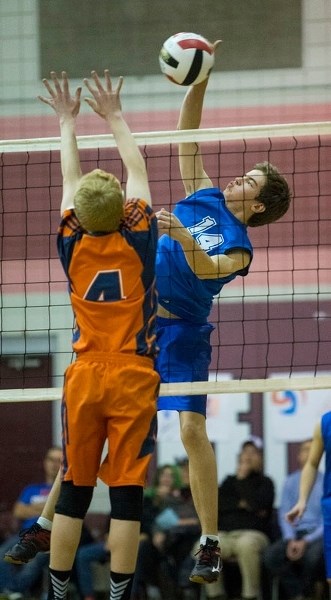 PLAYOFF FINALE – Josh Kelly of the Lorne Akins Gators guards the net in the SAPEC Tier 1 city volleyball final Thursday against the Morinville Wolves at Bellerose Composite
