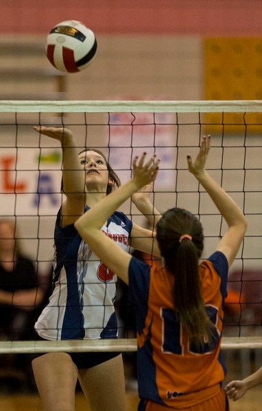 AIR BALL – Kylie Morrison of the Vincent J. Maloney Marauders makes contact with the volleyball against Ella Stanley of the Lorne Akins Gators at the SAPEC Tier 1 city