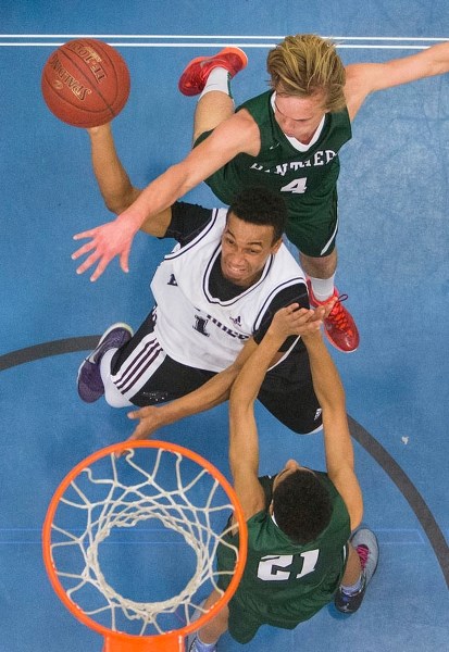 DETERMINED DAWG – Darryl Broderick of the Bellerose Bulldogs drives to the hoop against Jordan Bennett