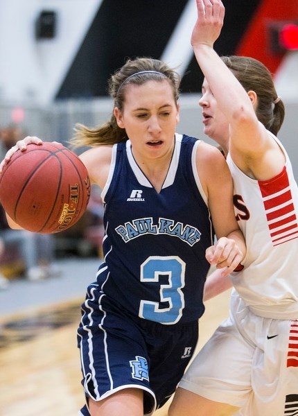 DRIVING – Allison Hunder of the Paul Kane Blues works the ball past a Jasper Place defender in Saturday&#8217;s third-place game at the 34th annual REB Invitational at Jasper 
