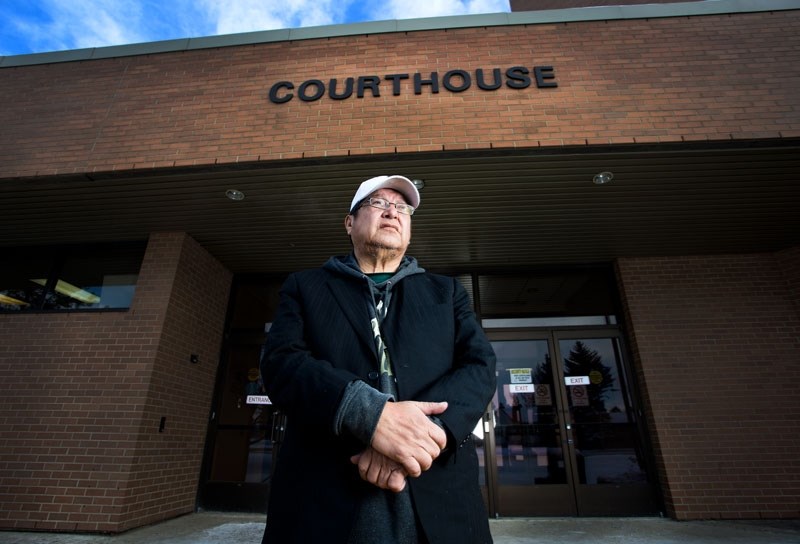 SURVIVOR – Mel Buffalo looks on at the Wetaskiwin courthouse where he works as a court advocate. Buffalo